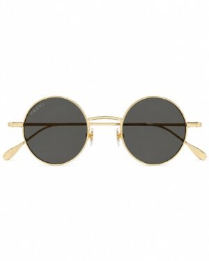 Gucci GG1649S 007 στρογγυλά γυαλιά ηλίου με χρυσό μεταλλικό σκελετό και σκούρους γκρι φακούς μπροστινή όψη